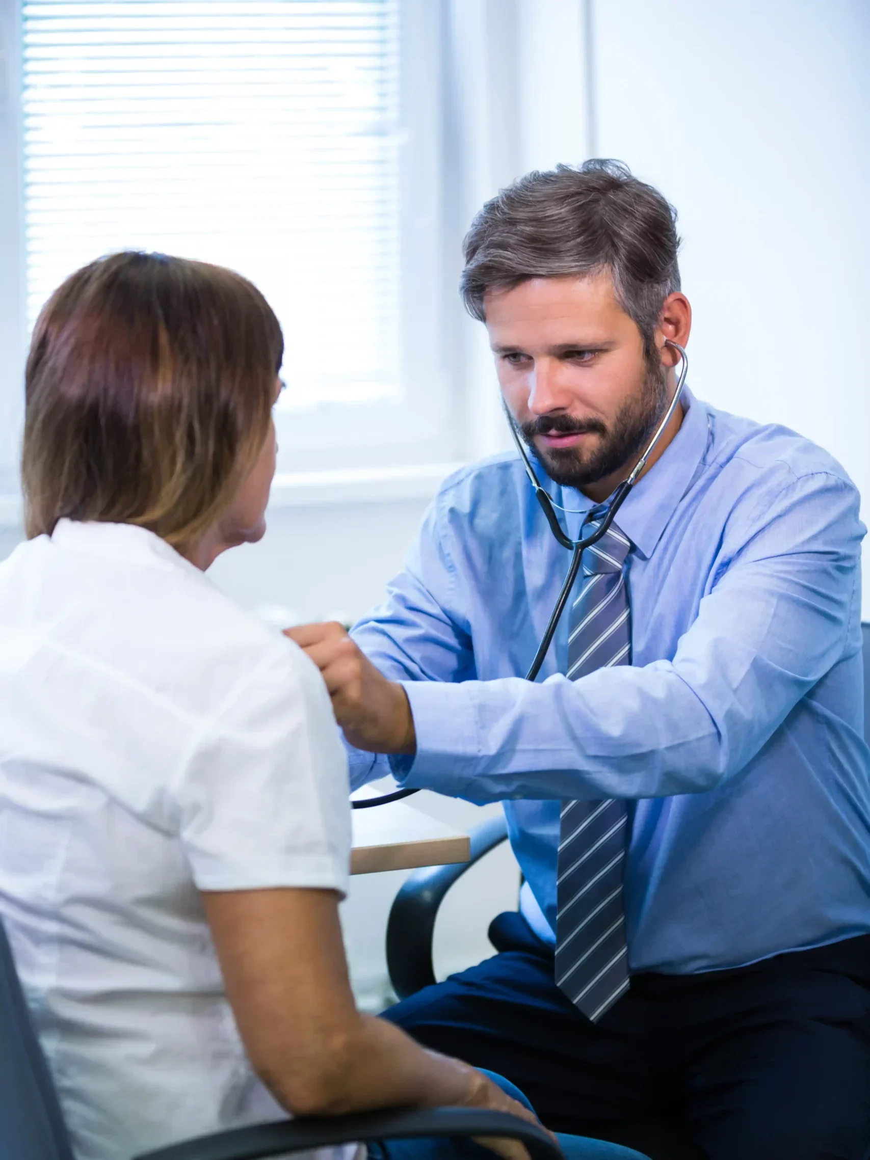 male-doctor-examining-patient (1)